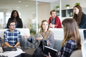 a group of people having a meeting